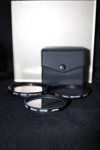 lot 47 image: Lot of 3 Hoya Camera Lens Filters with Case - Skylight 62mm, Skylight 58mm, UV 52mm