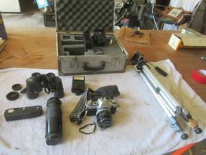 lot 73 image: Canon AE-1 35mm Camera with Accessories, Case, Tripod and Nikon Binoculars