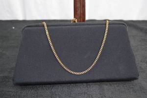 lot 219 image: Black And Gold Clutch