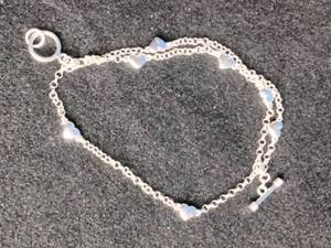 lot 4 image: Silvertone Heart Charm Bracelet
