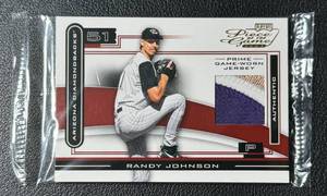 lot 6 image: RARE Randy Johnson 25 Tri-Color Game-Worn Jersey Relic 2003 Playoff Piece of the Game #POG-76 Numbered 2225 Baseball Card