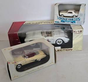 lot 231 image: Three Boxed Die Cast Replica Vehicles