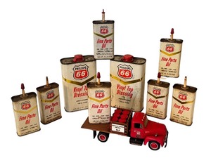lot 2A image: Collection of 8 Vintage Phillips 66 Oil & Vinyl Top Dressing Cans with Toy Truck