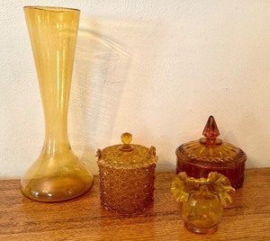 lot 91 image: Vintage Amber Glass Decorative Collection including Fenton Daisy and Button Amber Glass Basket Covered Candy Dish