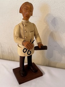 lot 103 image: Vintage Hand-Carved Wooden Barber Figurine with Scissors and Comb