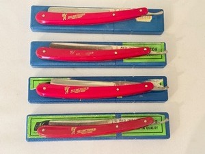 lot 147 image: Set of 4 Red Imp Wedge Straight Razors with Red Handles and Blue Cases
