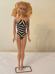 lot 148 image: Vintage Barbie Doll in Black and White Swimsuit