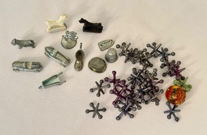lot 382 image: Vintage Game Piece Collection with Metal Jacks and Monopoly Tokens