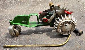 lot 446 image: Vintage Cast Iron Traveling Tractor Lawn Sprinkler