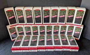 lot 320 image: Hallmark Pink Cadillac De Ville Ornaments