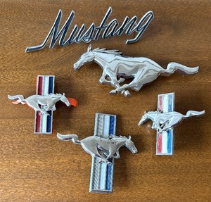 lot 502 image: Variety of Ford Mustang Car Emblems