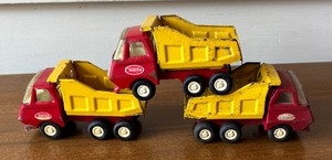 lot 573 image: Three Vintage Tonka Dump Trucks