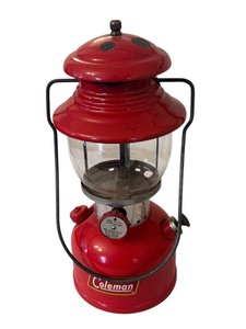 lot 559 image: Vintage Coleman Red Lantern with Enamel Wear