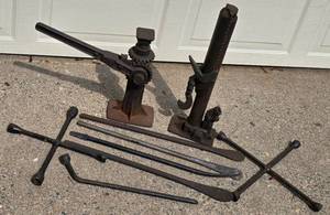 lot 587 image: Pair of Cast Iron Car Jacks  Tire Irons & More