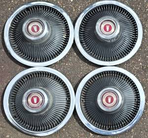 lot 302K image: Set of Four Galaxie Wheel Covers
