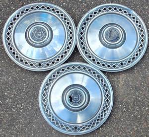 lot 677 image: Three Vintage Hub Caps