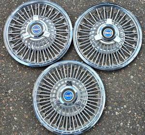 lot 678 image: Set of Three Galaxie Hub Caps
