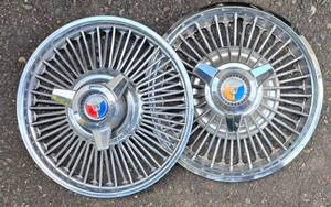 lot 679 image: Pair of Vintage Galaxie Hub Caps