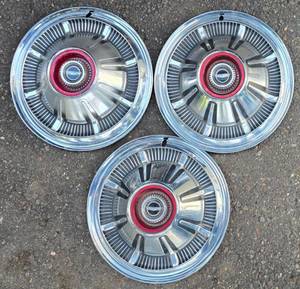 lot 680 image: Three Vintage Ford Bronco Hub Caps
