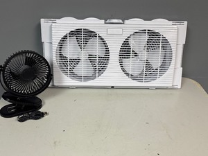 lot 33 image: Twin Window Fan. Intertek Model BN-7WD 21.5 Wide x 12 tall and 6 Clip Fan with Cord