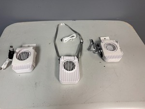 lot 35 image: Three Portable Rechargeable Neck Fans. USB Charging Cable Included. The fans also have a clip and will stand on flat service.