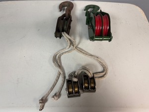 lot 57 image: Two Double-Sleave (wheel) Pulleys and Two 1 14 Double-Wheeled Pulley.   Newer Pulley is 32 diameter. Vintage is 2 diameter.