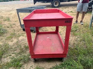 lot 64 image: Red Uline Cart (45 to handle x 25 34 x 33 Tall)