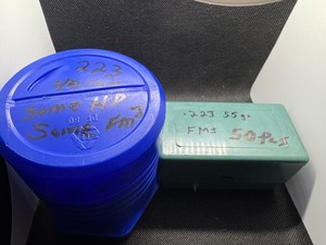lot 79 image: 223 Rifle HD and FMJ Ammo - Loose in blue container quantity 40) and .223 FMJ (green case quantity 50)
