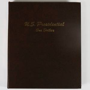 lot 18 image: US Presidential Commemorative One Dollar Coin Book