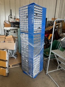 lot 20 image: Rotating 4-Sided Parts Bin (17 34 x 69) Shrink Wrapped and Full of Parts
