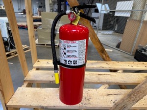 lot 7 image: Fully Charged Elegant Red Fire Extinguisher