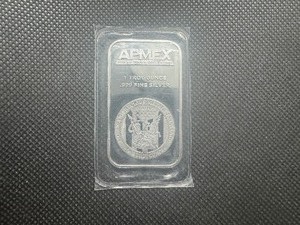 lot 16 image: APMEX 1 oz .999 Fine Silver Bar. Original Sealed Sleeve