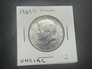 lot 56 image: 1964 D Uncirculated Kennedy Half Dollar. Very few bag marks. Full mint luster.