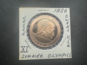 lot 61 image: 1936 Jesse Owens Crushes Hitlers Myth.