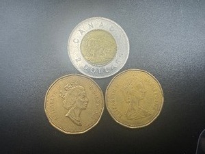 lot 62 image: (2) Canadian Dollar Coins  2 Dollar