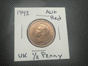 lot 70 image: 1943 Wartime UK 12 Penny AURed. Full mint luster, lightly circulated.