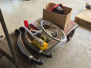 lot 946 image: Assorted Automotive Parts - Springs, Lights, Hub Caps