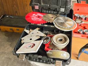 lot 957 image: Assorted Grinding Wheels, Assorted Saw Blades, (2) DeWalt Tool Cases (empty)