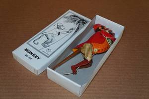 lot 172 image: Vintage Look Tin Litho Climbing Monkey