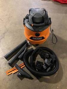 lot 16 image: RIDGID 16 Gal. 6.5 Peak HP NXT Shop Vacuum HD1600 Wet Dry Vac with Detachable Blower, Filter, Locking Hose and Accessories    Customer Returns See Pictures