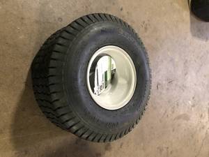 lot 33 image: MTD Genuine Factory Parts 20 in. x 8 in. Rear Tractor Wheel for Troy-Bilt Cub Cadet and Craftsman Lawn and Garden Tractors  Customer Returns See Pictures