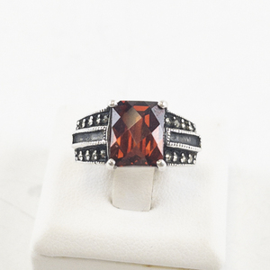 lot 56 image: Checker Cut Garnet and Marcasite Sterling Silver Ring Size 5.75