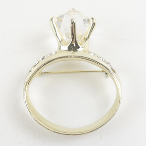 lot 166 image: Gold Tone Rhinestone Ring Brooch with Large Faceted Crystal Accent