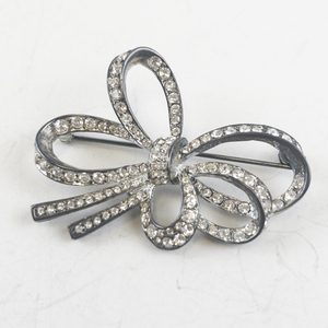 lot 182 image: Carolee Bow-Shaped Rhinestone Brooch