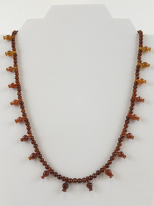 lot 243 image: Carnelian Beaded Necklace with Carved Bead Accents