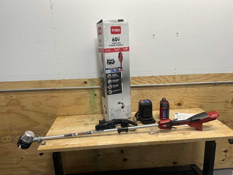 lot 57 image: TORO 60V MAX 14 in. (35.5 cm)  16 in. (40.6 cm) Brushless String Trimmer with 2.5Ah Battery and Charger (Model 51830)