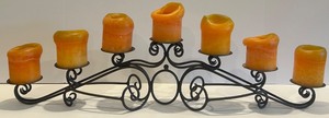 lot 23 image: Ornate Black Metal Candelabra with 7 Candle Holders and Orange Candles