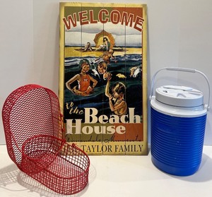 lot 32 image: Beach-Themed Decor with Cooler and Red Baskets