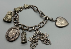 lot 19 image: Vintage Italian Multi-Charms Mostly Sterling Silver Bracelet with Buddha Compass and Heart Locket