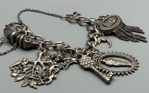 lot 20 image: Vintage Mostly Marked 925 Silver Charm Bracelet with Unique Charms